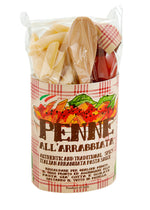 Pasta kit for making penne all'arrabiata pasta with ingredients, recipe and wooden spoon